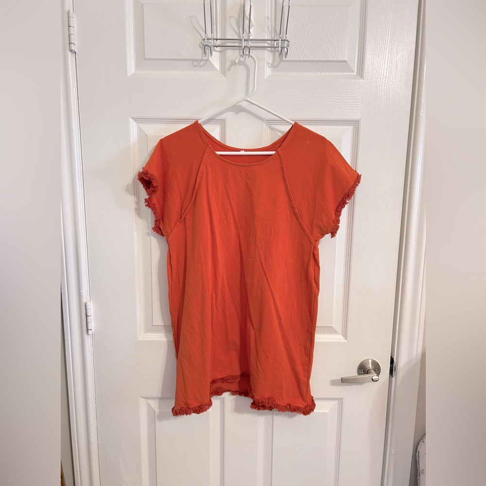 Really good quality short sleeved raw hem top. Size M
